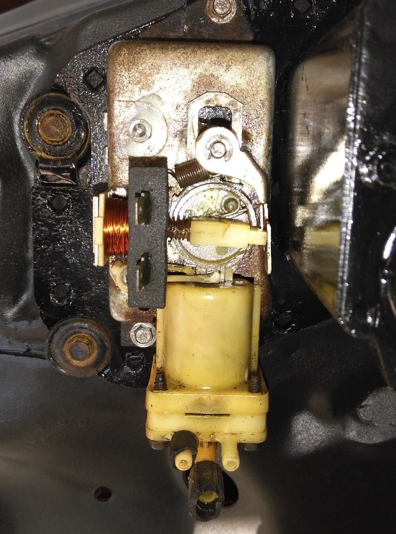 Inside picture of a 69 windshield washer pump Team Camaro Tech